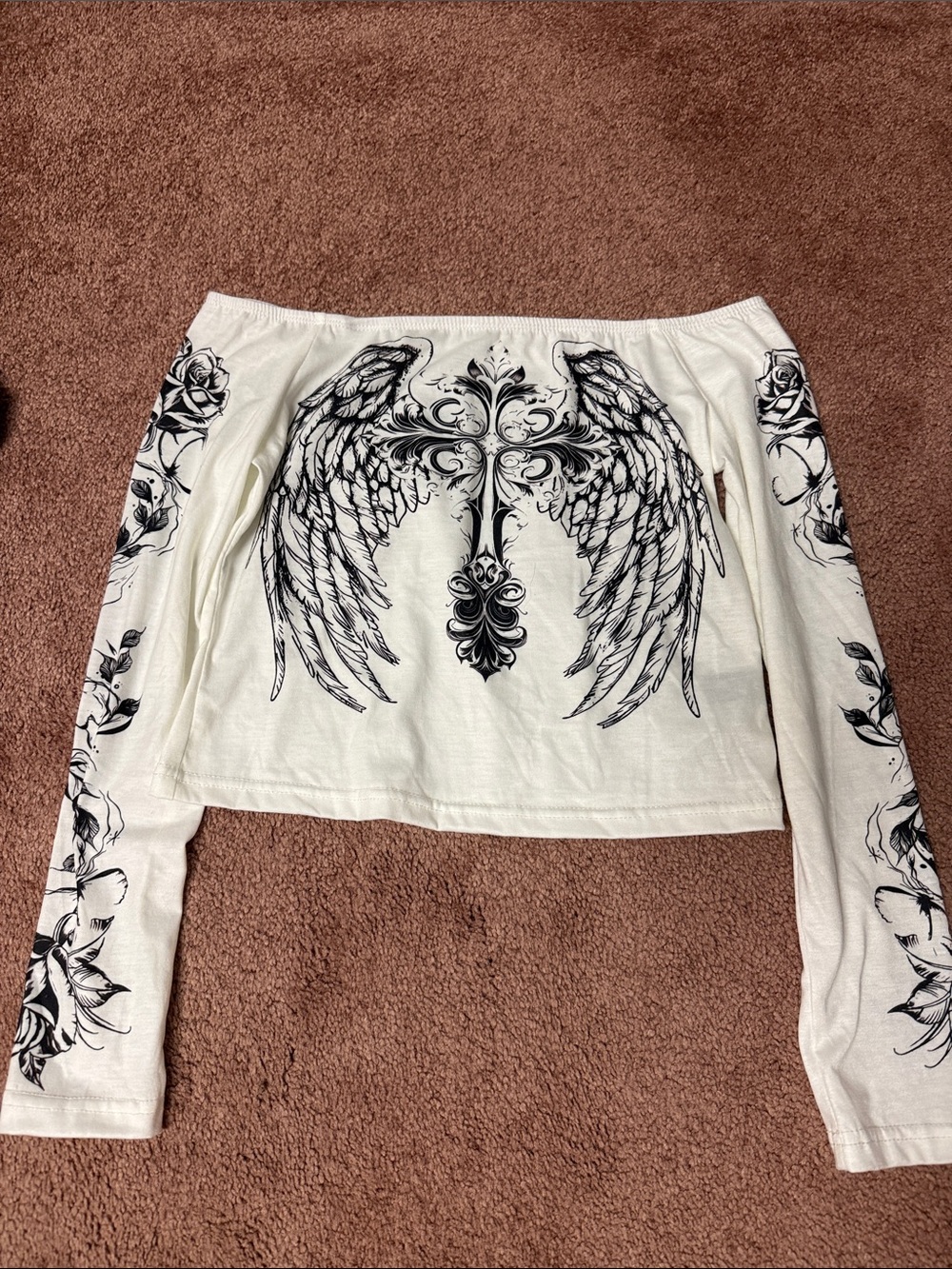 White Off-Shoulder Top with Black Wing & Cross Graphic